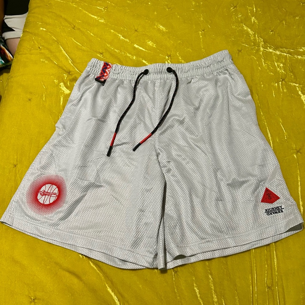 Nike White Athletic Shorts with Black Drawstring and Red Accents
